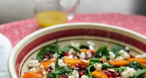 Spinach and Persimmon Salad with Goat Cheese and Pomegranate