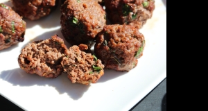 Fried meatballs in tomato sauce