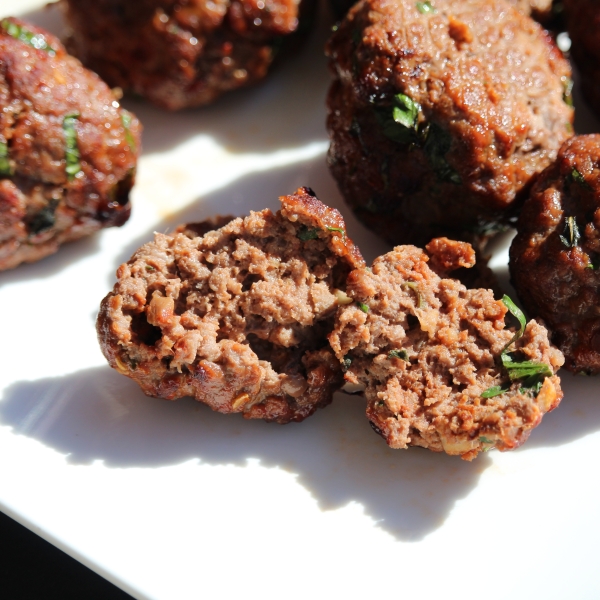 Fried meatballs in tomato sauce