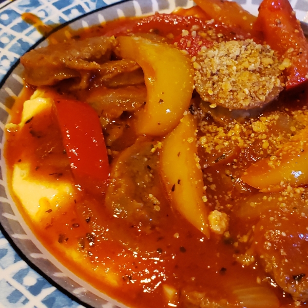 Sausage and Peppers over Creamy Parmesan Polenta