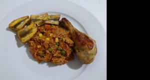 Nigerian Jollof Rice with Chicken and Fried Plantains