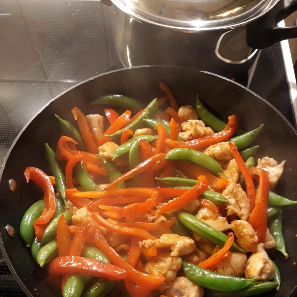 Szechuan Chicken, Peppers, and Peas on Rice