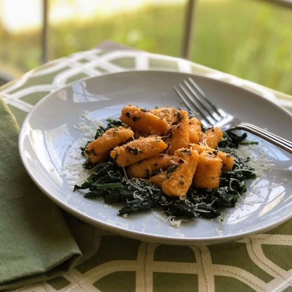 Butternut Squash Gnocchi with Garlic-Sage Butter over Wilted Spinach