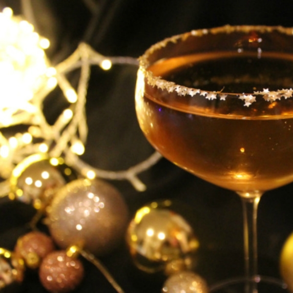 The Golden Bauble Cocktail with Prosecco, Amaretto, and Glitter
