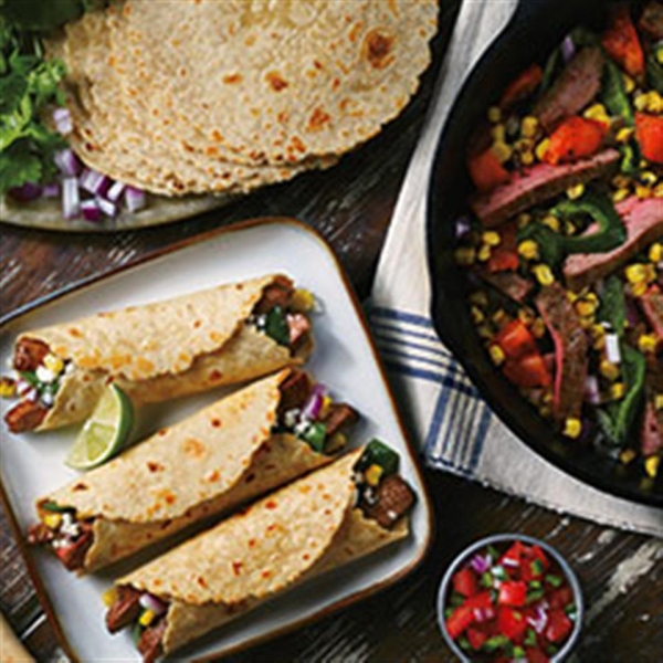 Charred Corn and Heirloom Tomato Steak Fajitas from Mission®