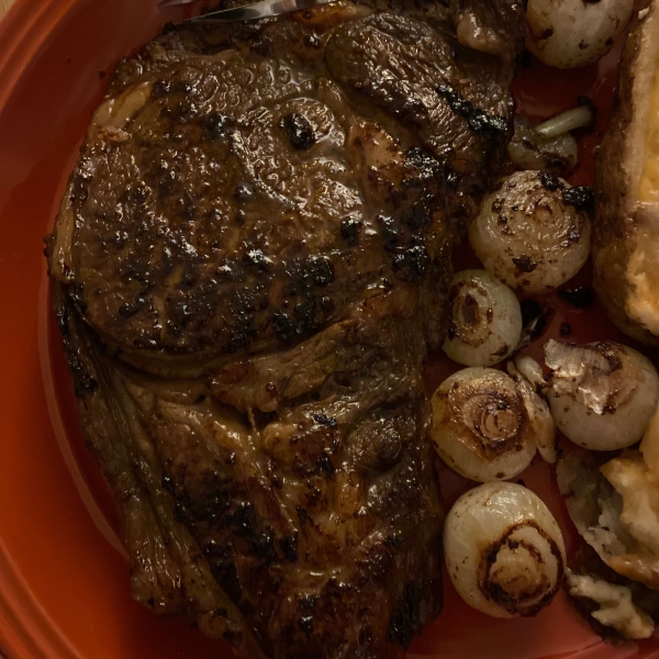 Pan-Roasted Ribeye with Caramelized Onions and White Truffle Butter