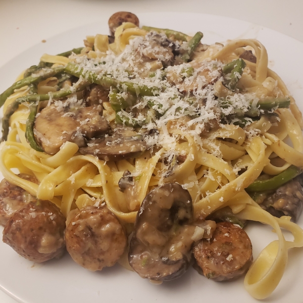 Fettuccine and Zoodles Topped with Chicken Sausage, Asparagus, and Mushrooms