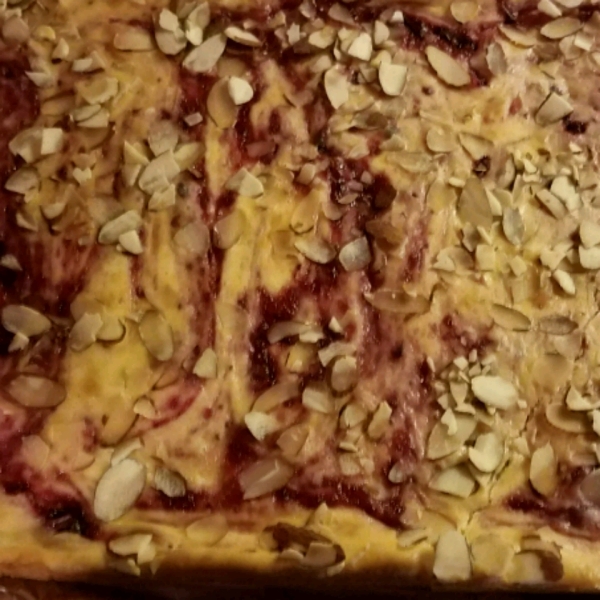 Cranberry Almond Swirl Cheesecake Cookie Bars