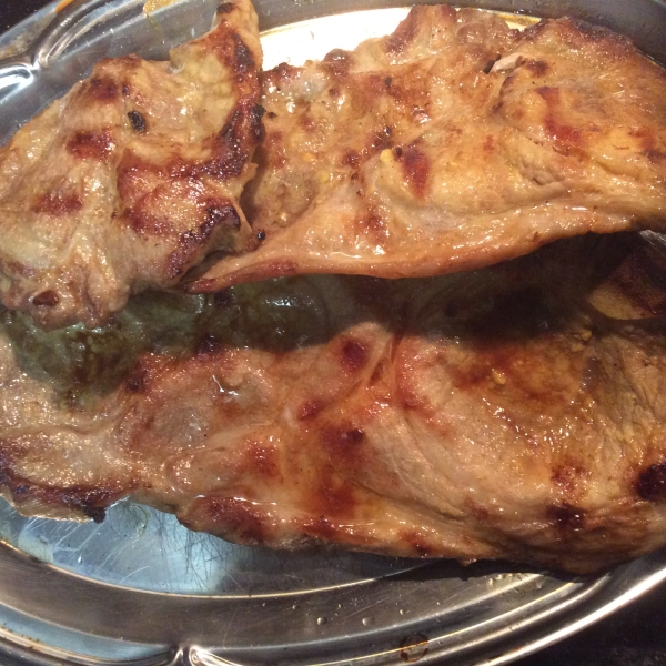 Grilled Pork Steaks with Lemon Butter Sauce