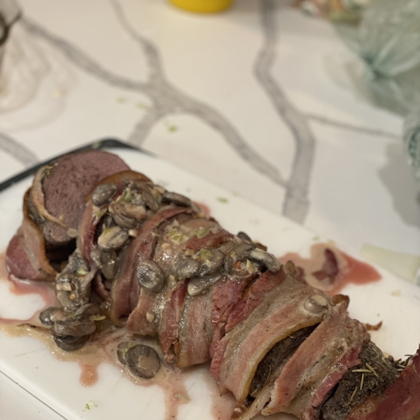 Bacon-Wrapped Venison Tenderloin with Garlic Cream Sauce