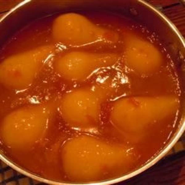 Flambeed Vanilla-Poached Pears with Apricot Sauce